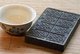China: Compressed brick tea or 'zhuancha' from southern Yunnan, scored for breaking into smaller pieces